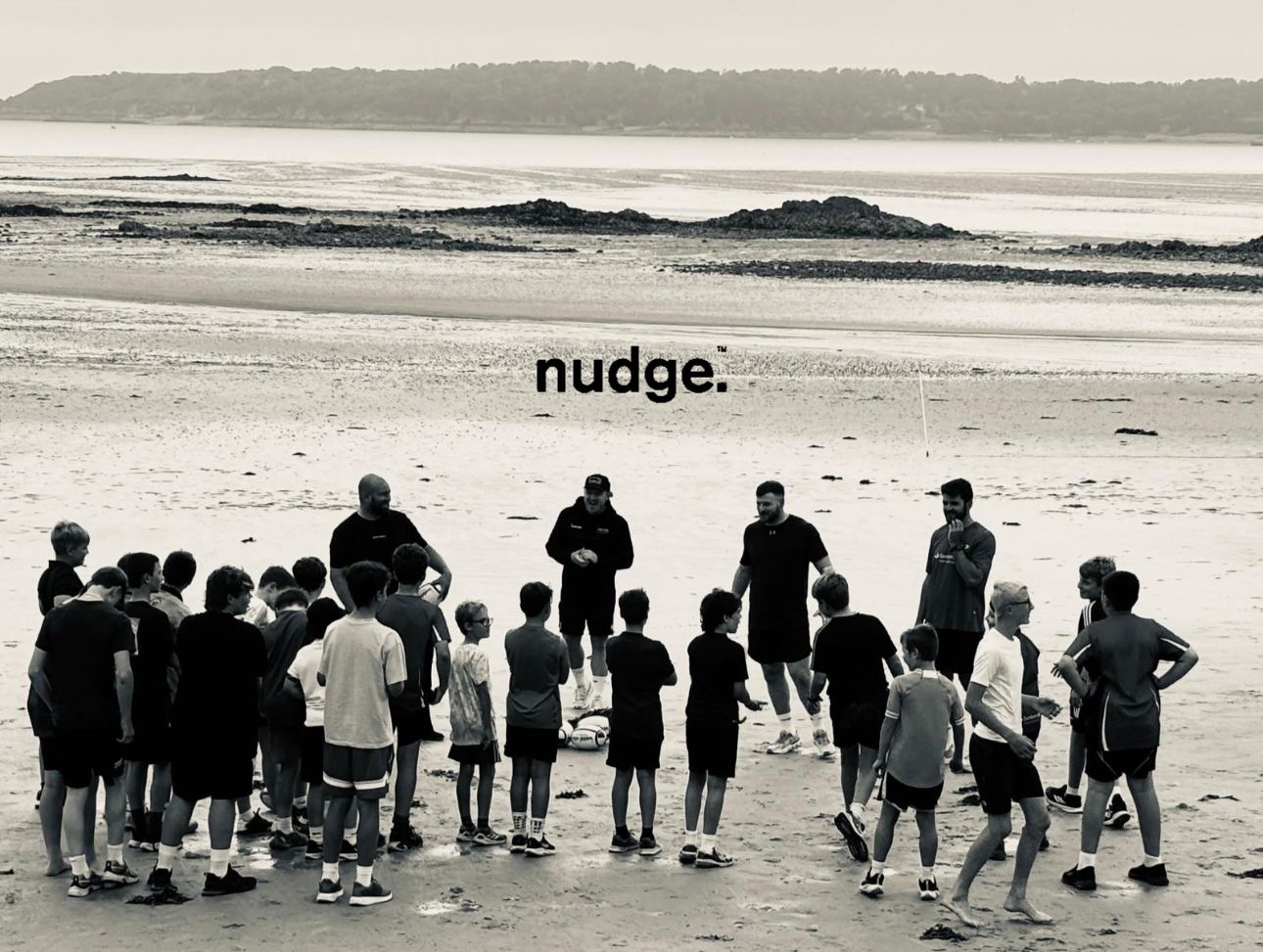 A nudge. coaching session on the beach in Jersey.